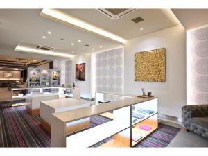 a living room with a table and a couch at K,M,H Art hotel by Kure Morisawa - Vacation STAY 11399v in Kure +12 photos