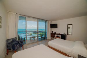 Ένα ή περισσότερα κρεβάτια σε δωμάτιο στο Hotel Bahia Chac Chi +29 φωτογραφίες