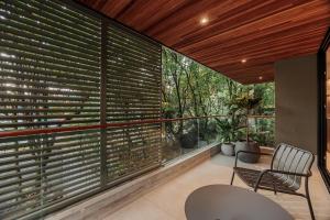 a room with a large window with blinds at Sereno Building in Medellín