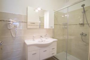 a white bathroom with a sink and a shower at ValDeSara in Malinska +35 photos