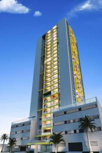 a tall building with palm trees in front of it at Studio 152 novo, completo com ar condicionado e muito bem decorado - centro in Mogi das Cruzes +6 photos