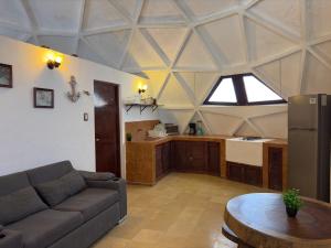 a living room with a couch and a table at House with Pool, Rooftop, Terrace & Bar, AC in Chuburná +10 photos