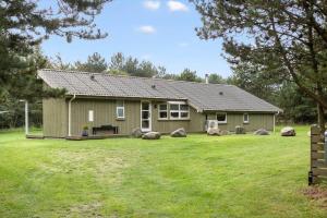 a house with a large yard in front of it at TV1394-Bindslev-Rollikevej-6 in Bindslev