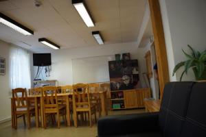 a dining room with a table and chairs at Hotel Alpin Murau in Murau