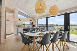a kitchen and dining room with a table and chairs at TV1584-Jerup-Engsig-Baekvej-44 in Jerup