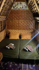 a green bed in the middle of a tent at Jonny's Hostel in San Juan
