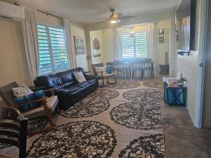 a living room with a couch and a table at Casa Verde in Naguabo