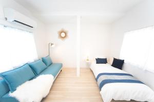 Postel nebo postele na pokoji v ubytování Miraie Kuwana Shimofukayabe 2 + 44 fotografií