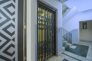 a building with a door with a gold gate at Collection O Bricks Inn Hazra Road Near Birla Mandir in Ballygunge