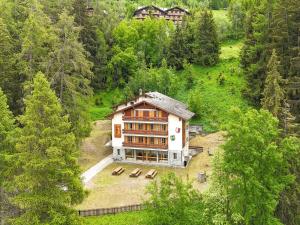 a large house in the middle of a forest at Apartment in Les Agettes with ski storage in Agettes
