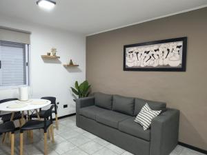 a living room with a couch and a table at DS confort dpto 3 in General Pico