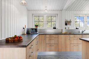 a kitchen with a bowl of fruit on a counter at TV1295-Bindslev-Uglevej-6 in Bindslev