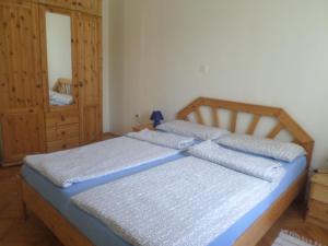 a bedroom with two twin beds and a dresser at Apartment Jana in Štinjan