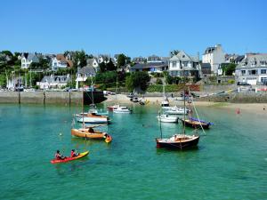 a group of boats in the water near a beach at Villa with Private Pool in Plestin-les-Grèves in Plestin-les-Grèves