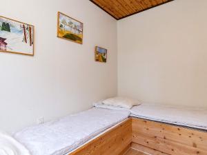 two beds in a room with white walls at 6 person holiday home in Øster Assels in Øster Assels