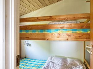 a bedroom with a bunk bed in a room at Tranquil Beach Retreat - By Traum in Idestrup
