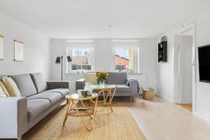 a living room with a couch and a table at TV1654-Albaek-Hovej-3 in Ålbæk