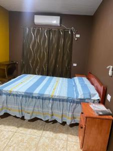 Ένα ή περισσότερα κρεβάτια σε δωμάτιο στο Hotel Abigail Garupa +8 φωτογραφίες