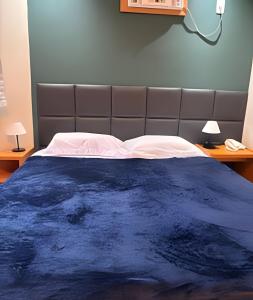 Ένα ή περισσότερα κρεβάτια σε δωμάτιο στο Flat ótima localização com vaga +11 φωτογραφίες