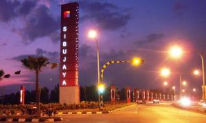 a street at night with traffic lights and a building at Tan 8034 SIBU JAYA in Sibu