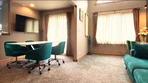 a room with a table and chairs and a couch at Five room 120 SKY TREE SENSOJI FreeParking 1292sqft in Tokyo