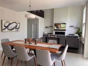 a living room with a wooden table and chairs at Severn Woodland in Severn
