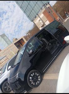 a black car parked on the side of a street at Car Rental in Kempton Park