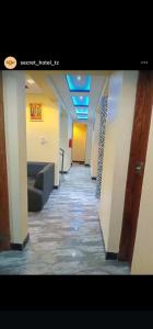 a hallway of an office with a long corridor at Secret hotel in Dar es Salaam