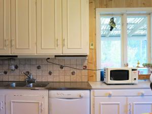 Η κουζίνα ή μικρή κουζίνα στο 8 person holiday home in HOVA +29 φωτογραφίες