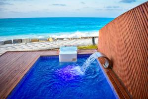 a hot tub with a water slide on the beach at CONCHA Beach Hotel, New Alamein in El Alamein