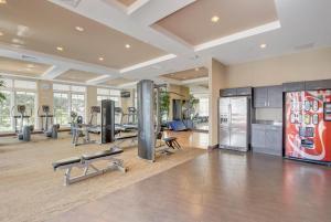 a gym with treadmills and machines in a room at One Bedroom In Lux Condo,casa Costa! Wbeachpass! in Boynton Beach