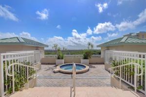 a patio with a pool in the middle of a house at One Bedroom In Lux Condo,casa Costa! Wbeachpass! in Boynton Beach
