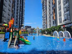 a water park with people playing in the water at Wunlux stay in Kota Kinabalu
