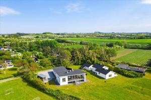 an aerial view of a large white house in a field at 20503-Samso-Strandkrogen-37 in Sælvig