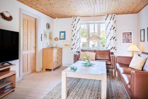 a living room with a couch and a coffee table at 20601-Samso-Nordby-Hovedgade-2 in Nordby