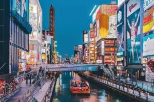 a river in the middle of a city with buildings at Lucky NAMBA MINAMI 大阪難波 なんば in Osaka