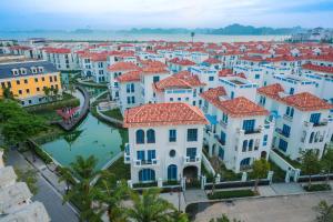 an aerial view of a city with white houses at Azure Bay Hotel in Ha Long