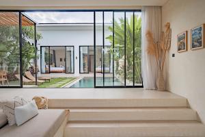 a living room with a view of a house at Lucky Villa 1 in Uluwatu