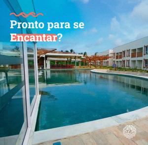 a swimming pool at a hotel with the words tropico panama se encanta at Pipa Privilege Ocean in Pipa