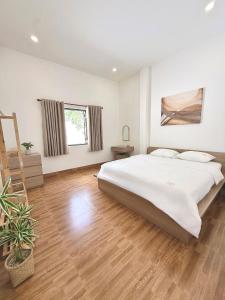 Ένα ή περισσότερα κρεβάτια σε δωμάτιο στο Loci homestay +56 φωτογραφίες