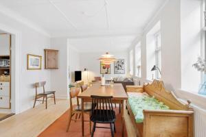 a living room with a table and a couch at AE208-Aeroskobing-Brogade-4 in Ærøskøbing
