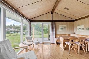 a living room with a table and chairs at SB50361-Nordborg-Krabbestien-11 in Nordborg