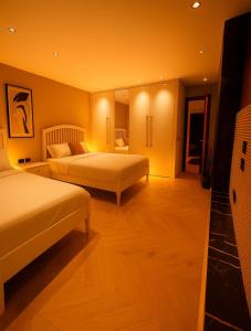 Ένα ή περισσότερα κρεβάτια σε δωμάτιο στο Ultra Luxury 3BR Hotel Apartment 260m