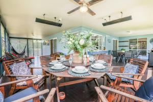 a dining room with a table and chairs at On Agnes Time - Large, 3-Bedroom, Coastal Home in Central Agnes Water, Short Walk to Stunning Main Beach in Agnes Water