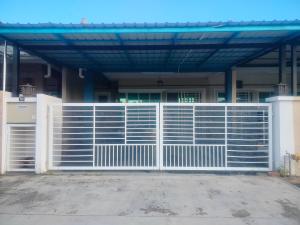 a white gate in front of a house at Stingless Bee Homestay in Kluang