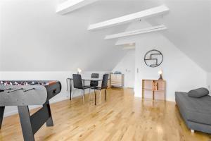 a living room with a table and a couch at AE211-Marstal-Hvidtfeldtsgade-32 in Marstal +14 photos