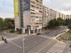 an aerial view of a street with a large building at City Center & Free Parking - Rest & Nest Boho Deluxe Apartment in Debrecen