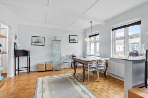 a kitchen and dining room with a table and chairs at AE219-Marstal-Ommelsvejen-14 in Marstal
