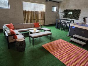 a living room with a couch and a table at Barn on the Farm Holiday Lets in Magherasaul +1 photo