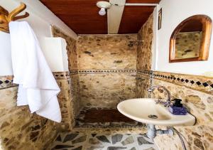 a bathroom with a sink and a shower at Finca VIP de lujo privada, jacuzzi y paz cerca de la piedra de Guatape in Guatapé +113 photos
